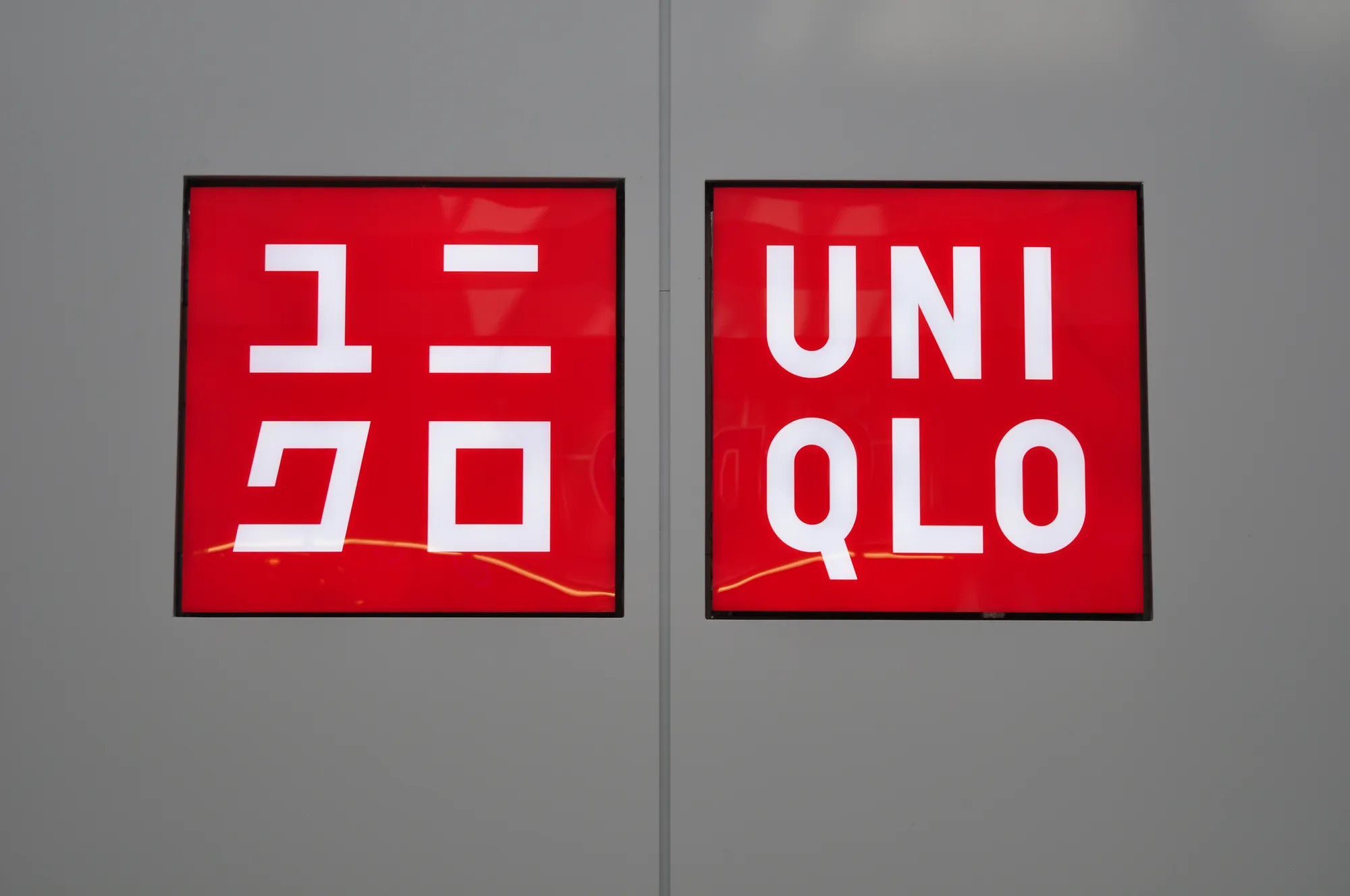 UNIQLO red illuminated lightbox cabinet signs in Vancouver