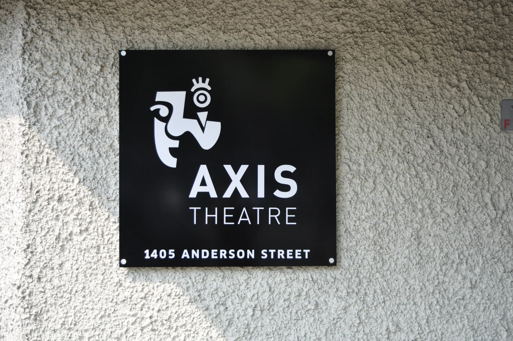 AXIS Theatre wall sign straight-on view in Vancouver
