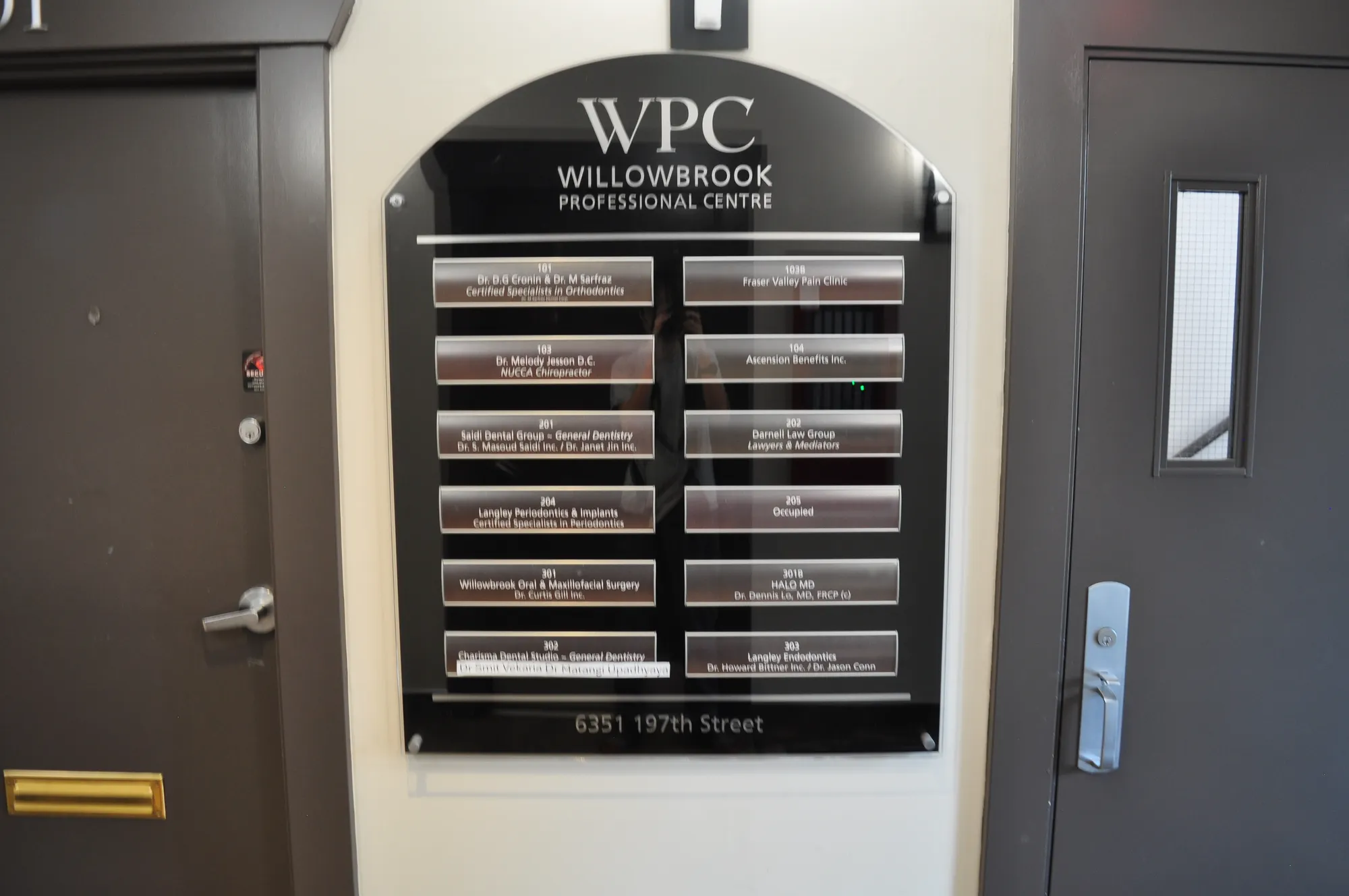Willowbrook Professional Centre glass tenant directory in Langley