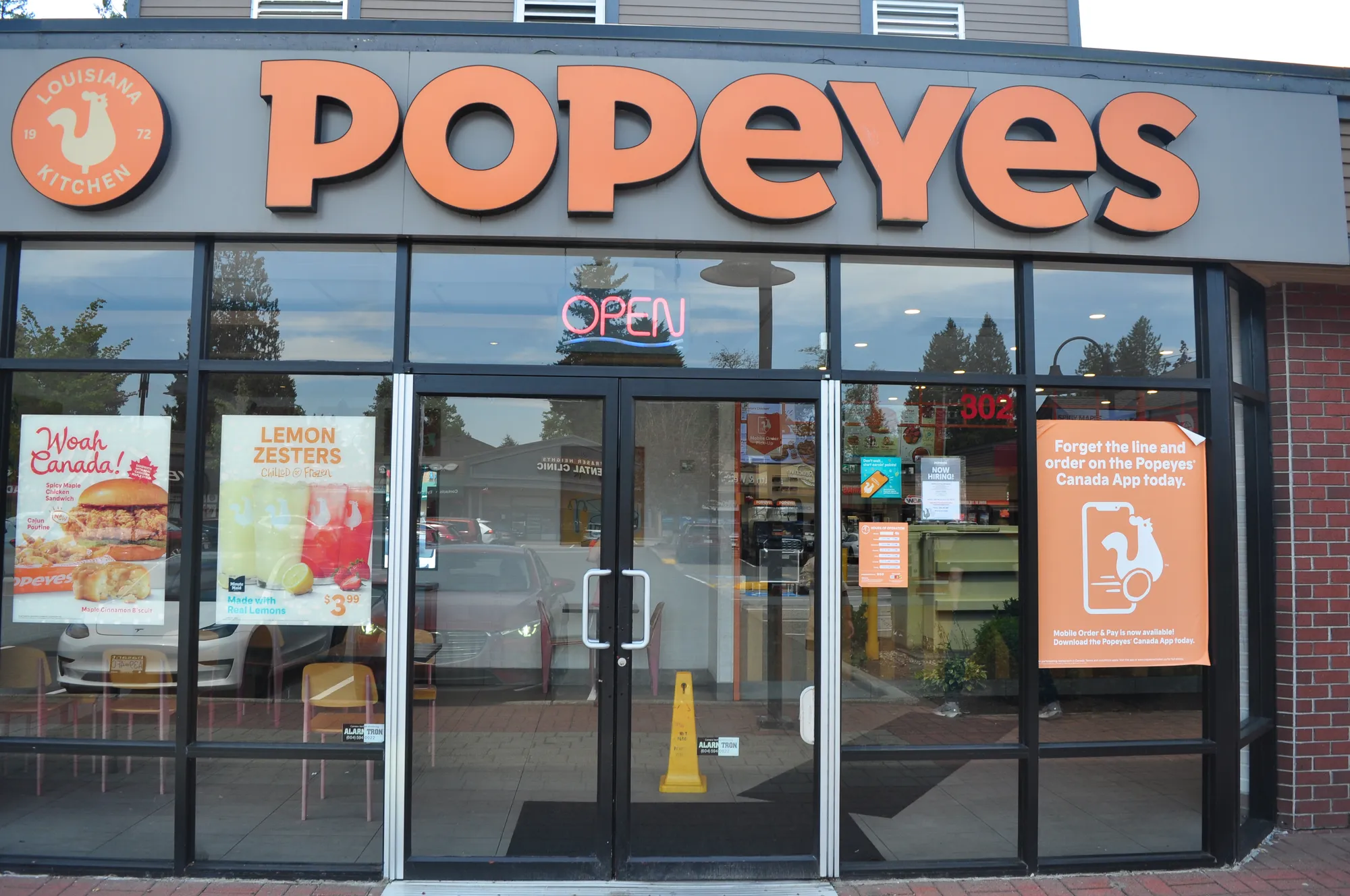 Popeyes illuminated channel-letter storefront sign in Vancouver