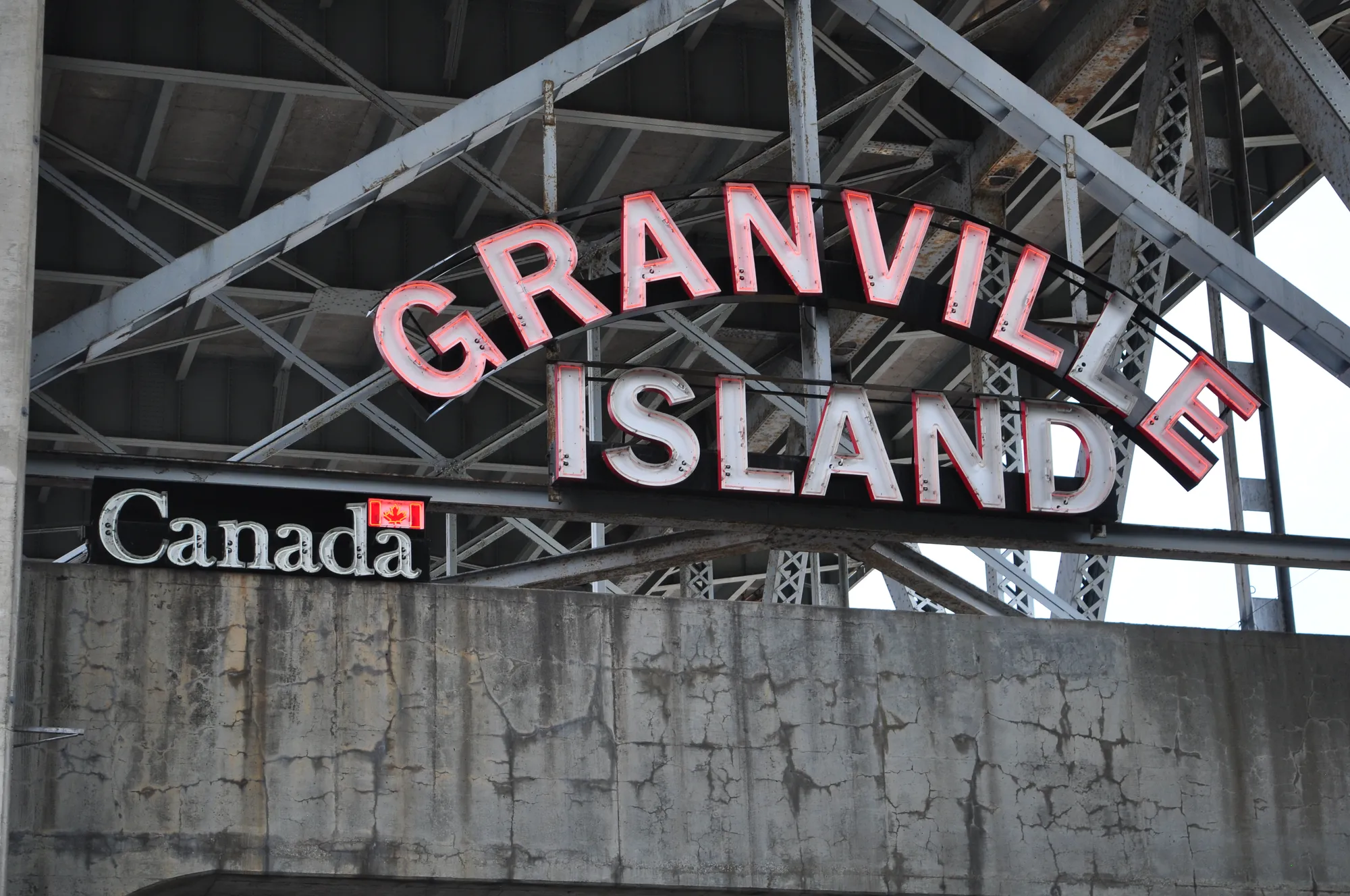 Granville Island red neon channel-letter landmark sign in Vancouver